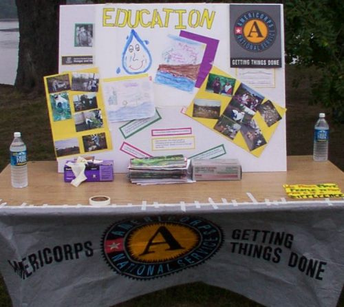 Display table, featuring Americorps, NJ Community Water Watch, and NJ Public Interest Research Group.