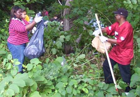 Volunteers at work, including The Waters CWC youth pastor William Jackson (right).