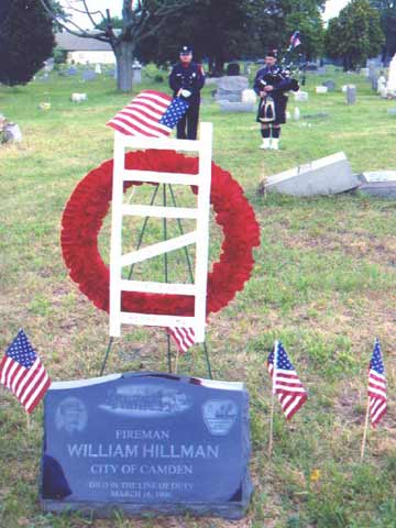 honor guard melendez standing guard as captain david dilks plays the bagpipes at dedication of headstone for fireman william hillman