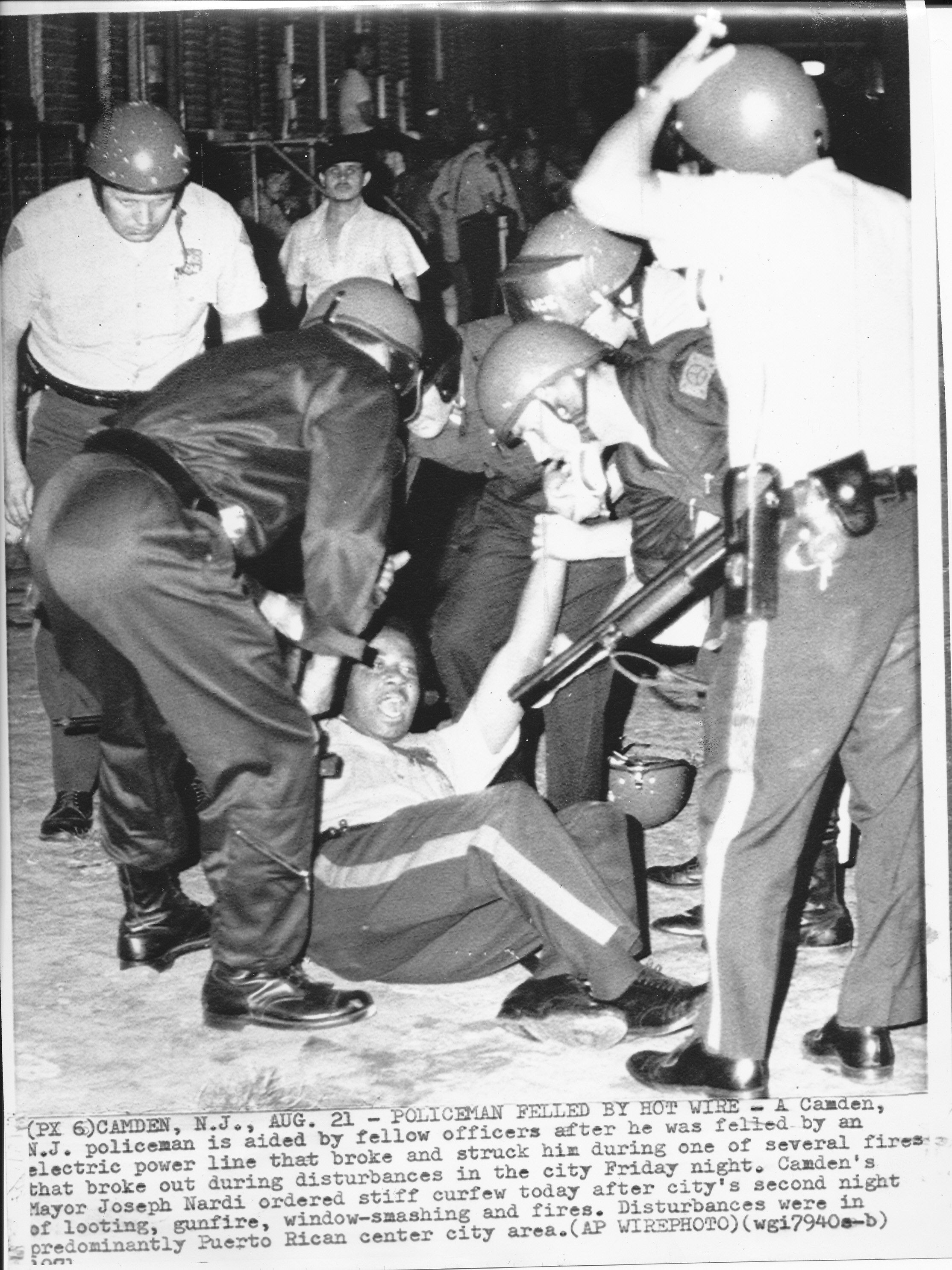 CAMDEN: Camden policeman is aided by fellow officers after he was felled by an electric power line